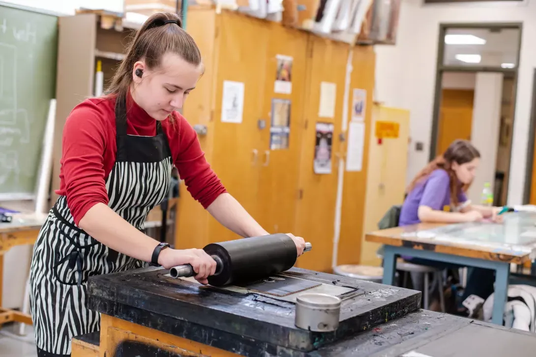 Printmaking student preparing a print plate